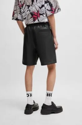 Perforated faux-leather shorts with stacked logo